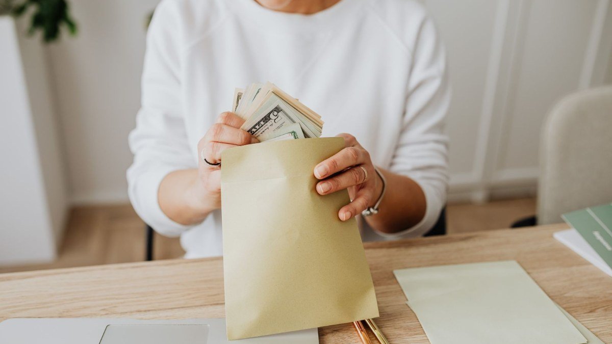 Cash envelopes laid out on a table for envelope budgeting