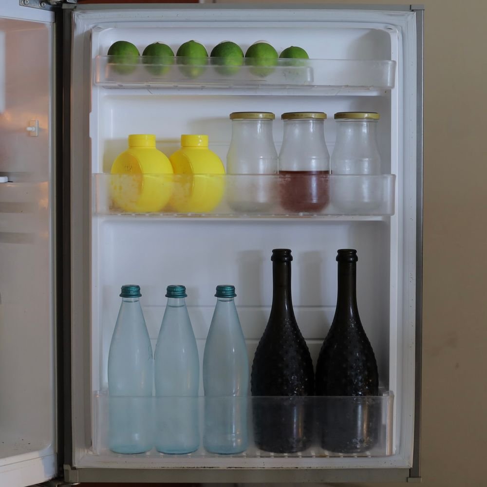 Checking a refrigerator door seal during a DIY home energy audit